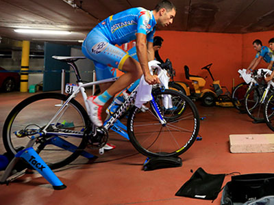 The Astana team spin their legs on indoor trainers during a cancelled stage of the Giro in 2013
